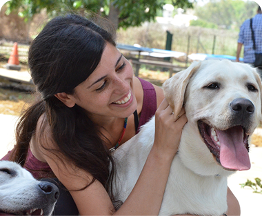 girl smiling with happy dog