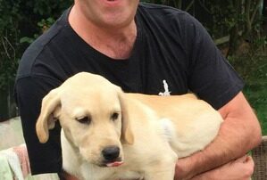 Martin holding a dog