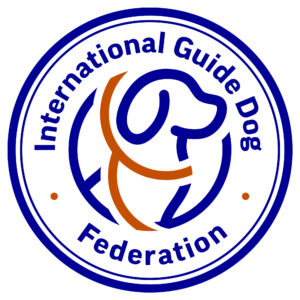 Circular logo with a stylized dog outline in the center, surrounded by the blue text International Guide Dog Federation and two orange dots.